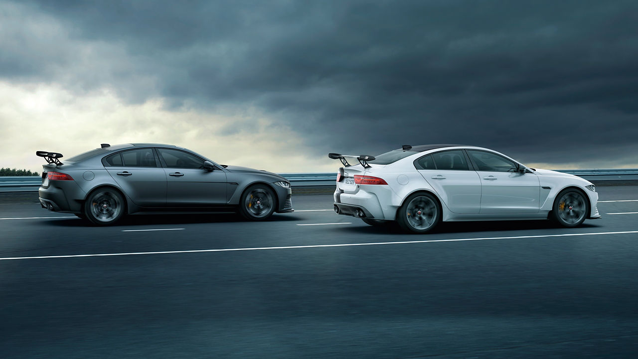 Two Jaguar Models running on the Road