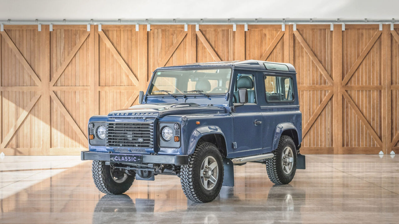 Classic Land Rover in sunlit garage