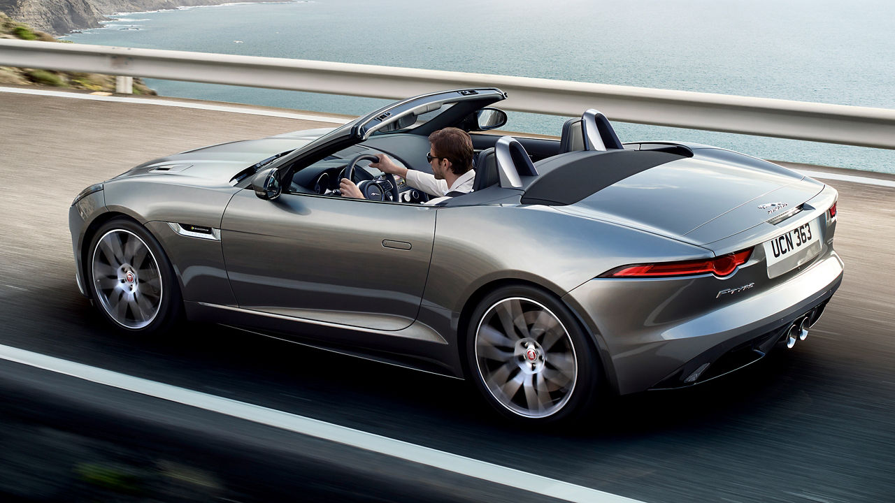 Jaguar F-TYPE  running on beach side road