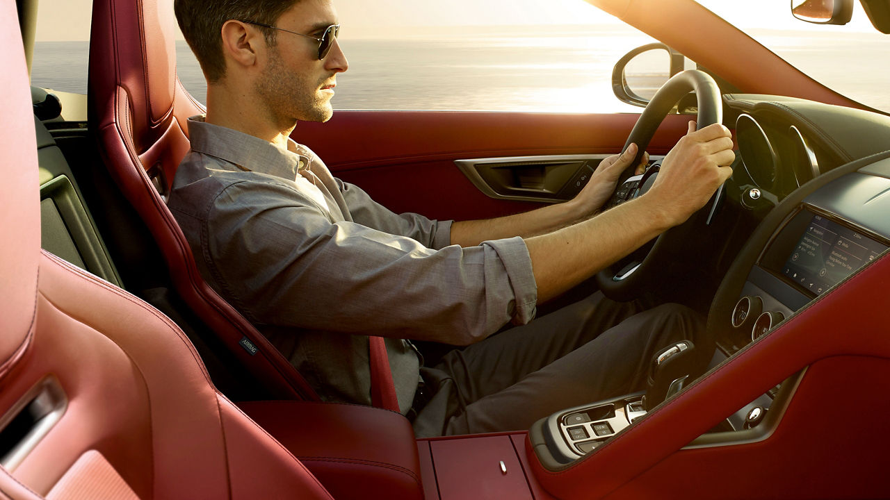 A man driving jaguar F-Type