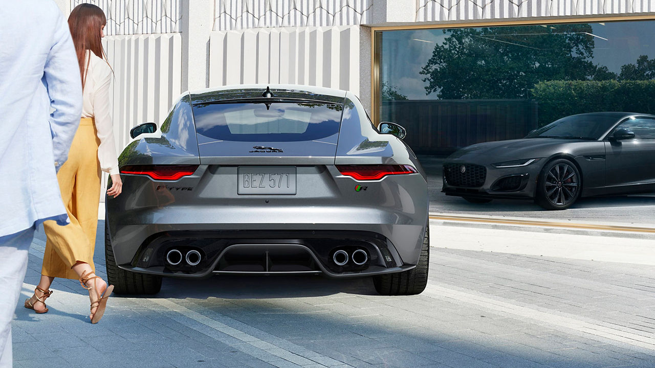 Jaguar F-Type parked in front of building 