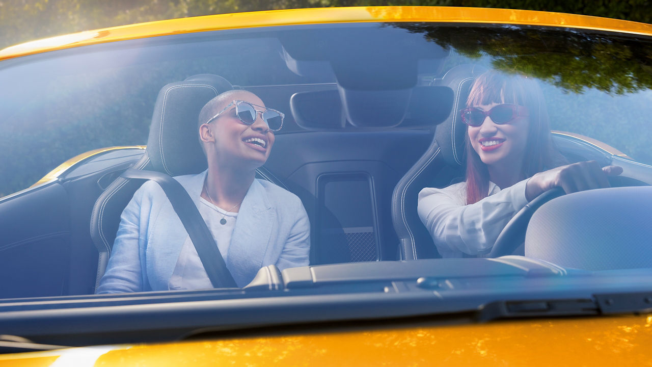 Girl's enjoying ride in Jaguar F-Type