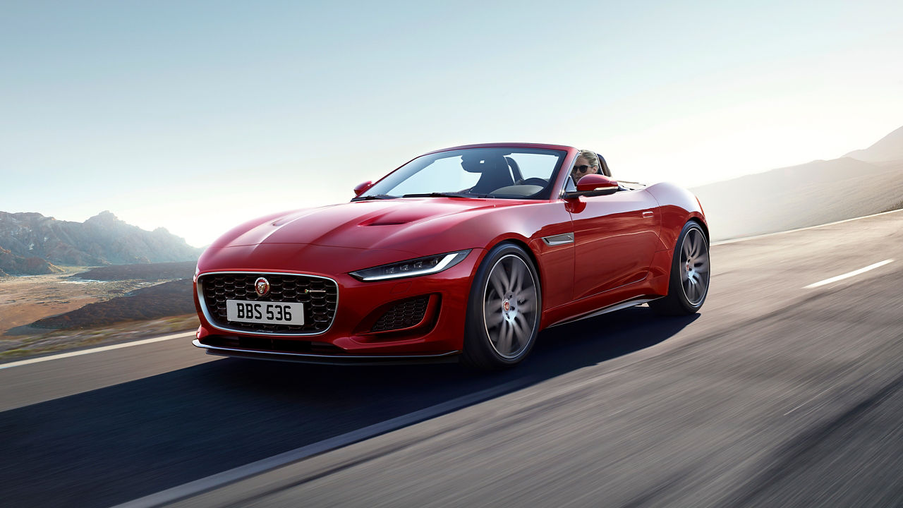 Man is Driving Jaguar F-Type on Mountain Runway Road