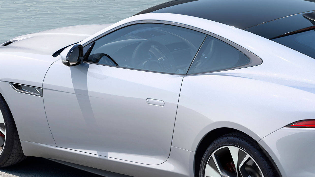Jaguar F-Type parked near sea side