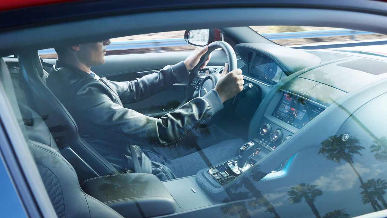 Man enjoying ride in Jaguar F-Type