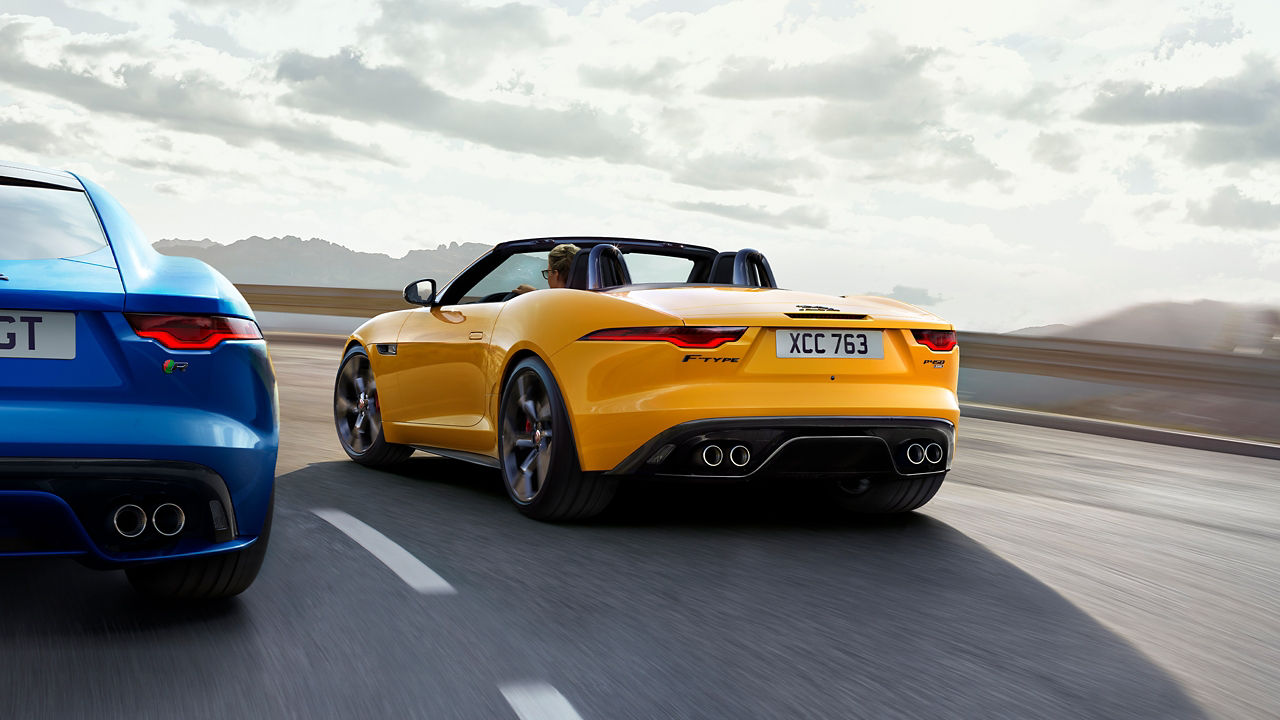 Jaguar Two F-Type running on road