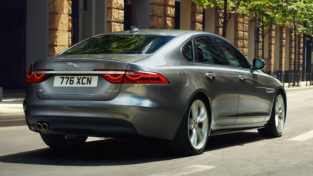 Jaguar XF running on city road