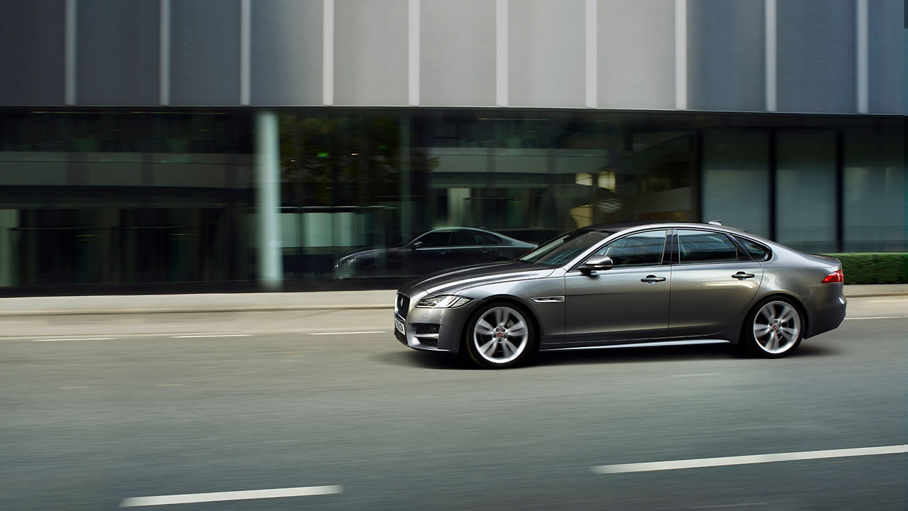 Jaguar XF running on city road