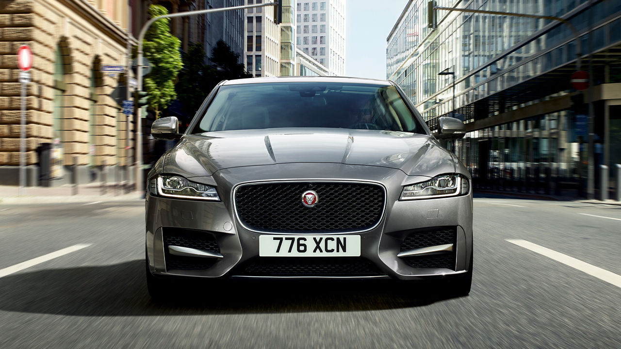 Jaguar XF running on city road