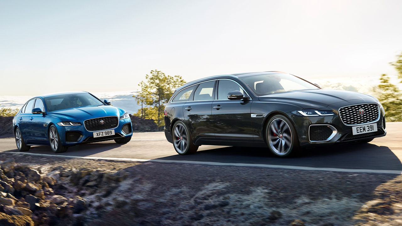 Jaguar XF cars running on asphalt highway road