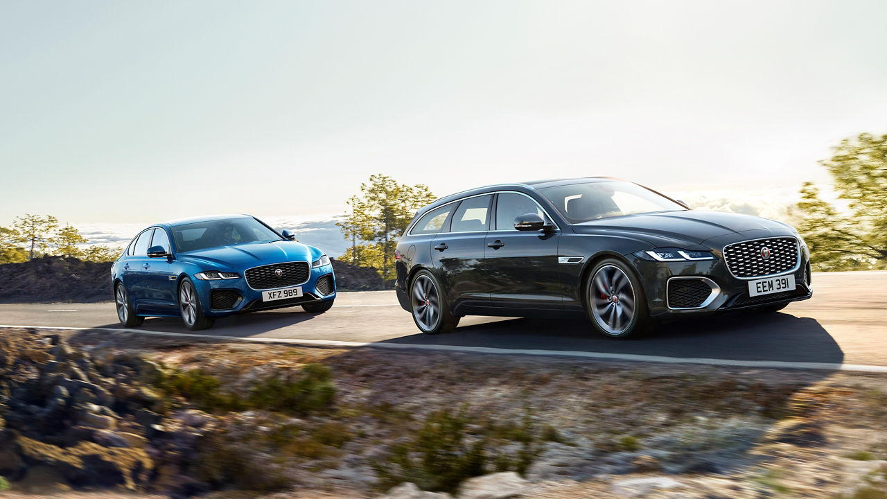 Jaguar cars running on highway route