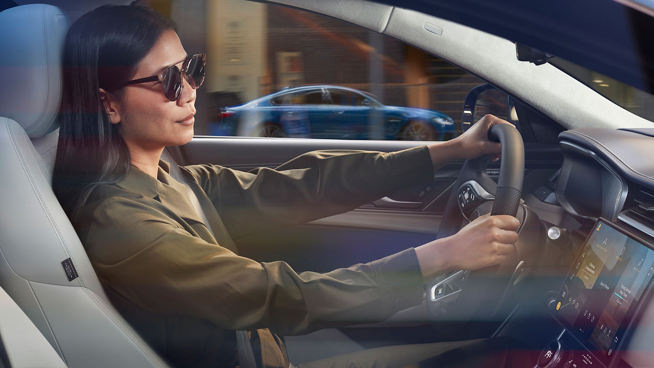 women Driving the Jaguar XF car