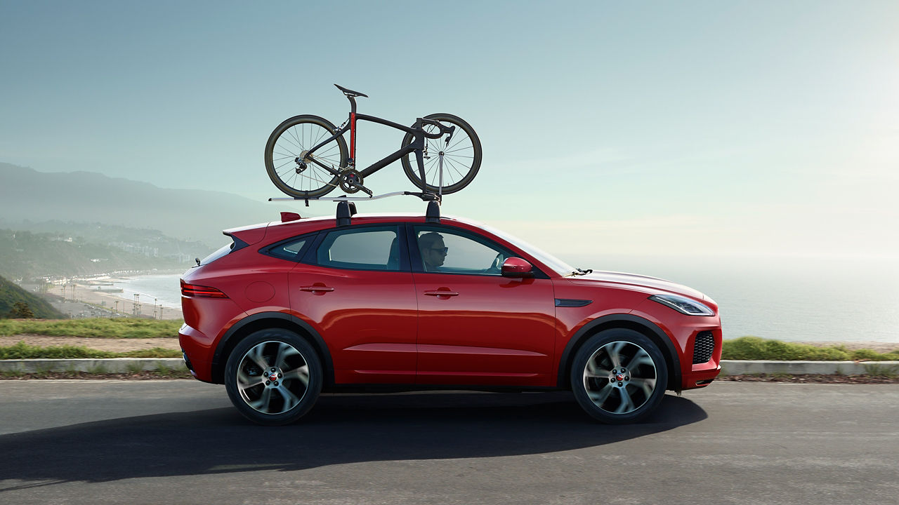 Jaguar E-Pace  running on the hill road 