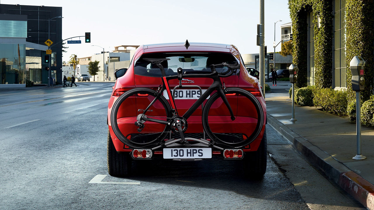 JaguarJaguar E-PACE with wheel mounted cycle carrier parked on city road