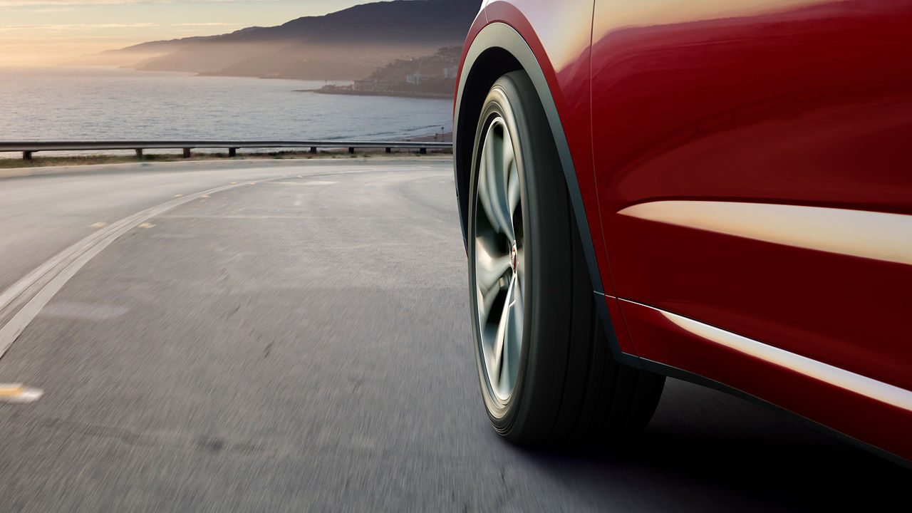 Jaguar E-Pace running on stable wheels, close-up view