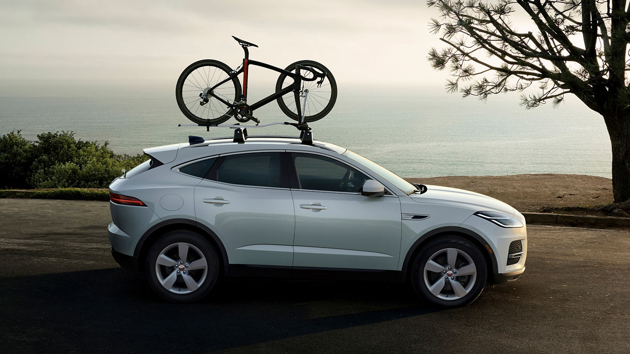 Jaguar E-Pace carrying Cycle on roof mounted rack