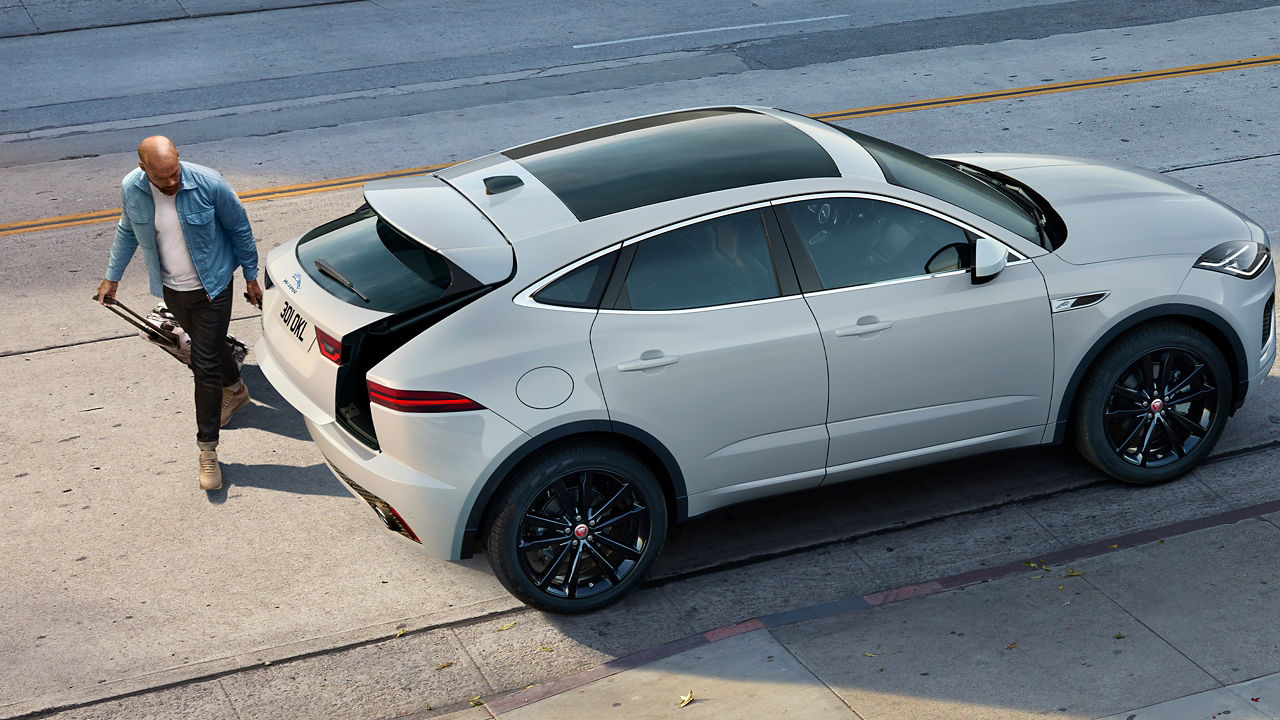 Man is loading luggage in Jaguar E-PACE