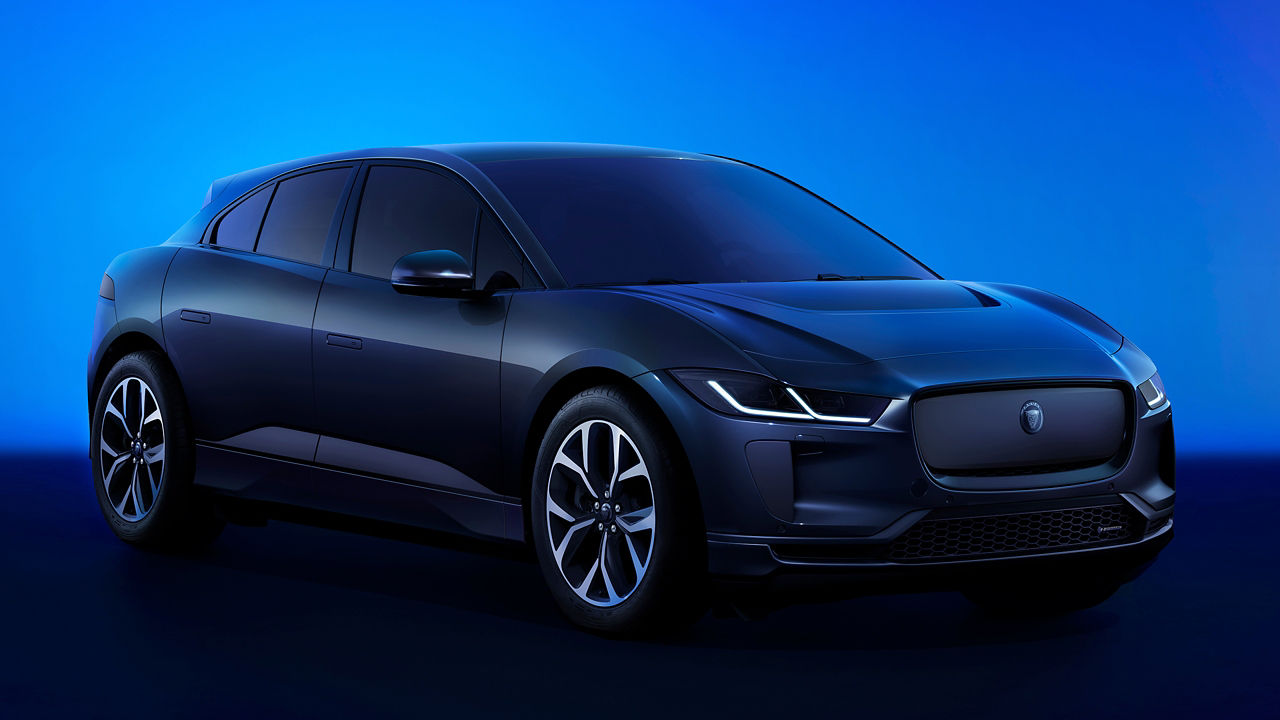  2024 Jaguar I-Pace parked in blue room. 