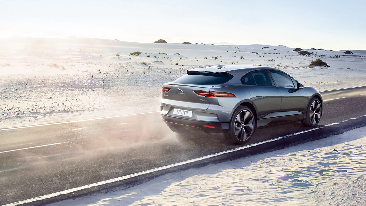 Jaguar I-Pace running on sand road