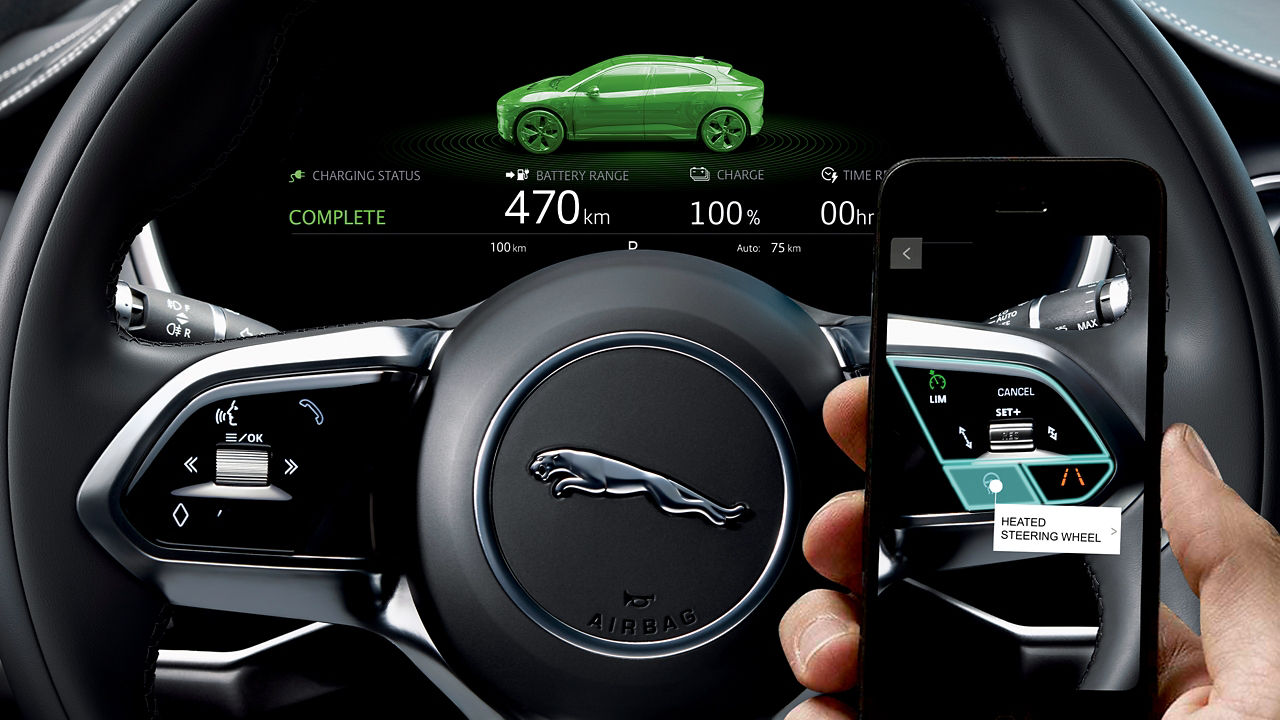Close View of Jaguar I-PACE Steering Wheel and Mobile
