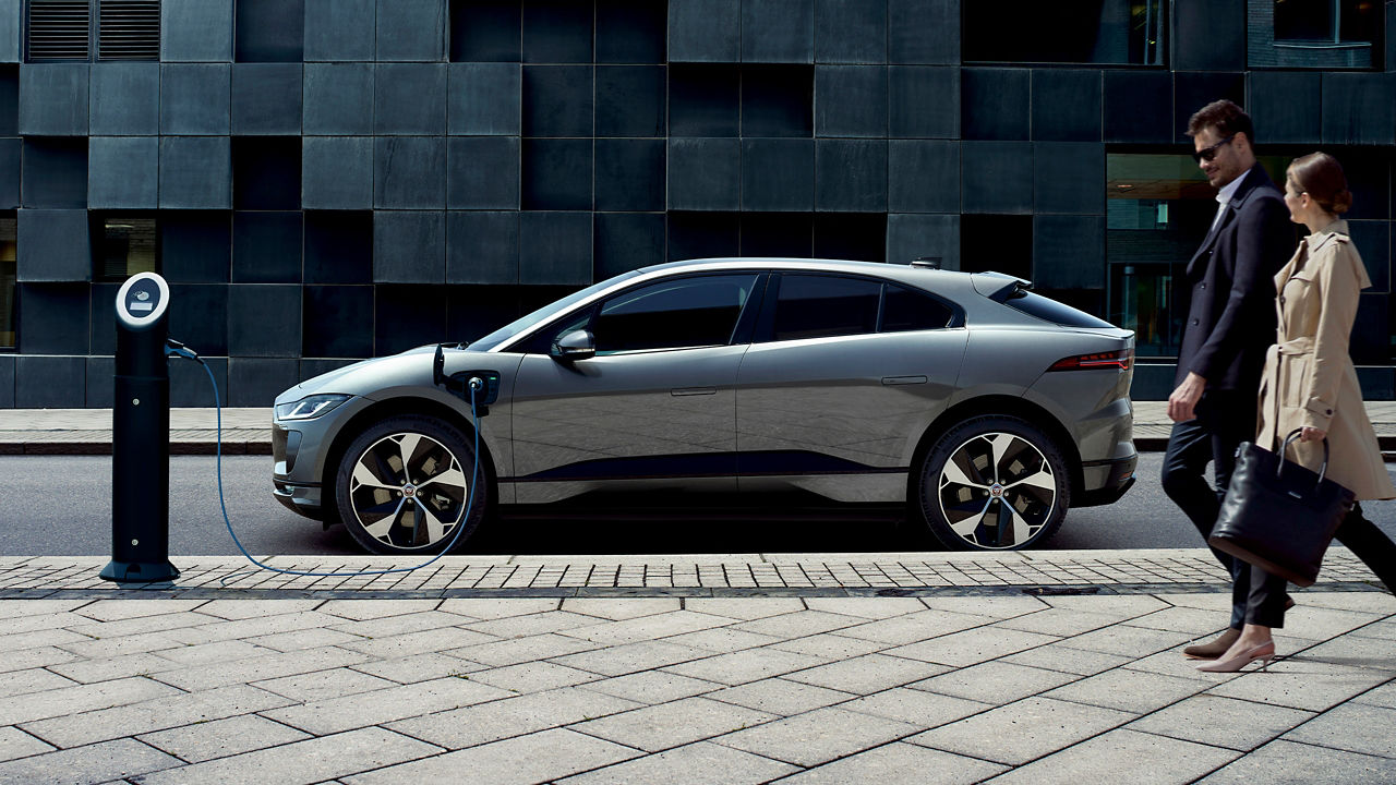 Parked Jaguar I-Pace at road side charging station