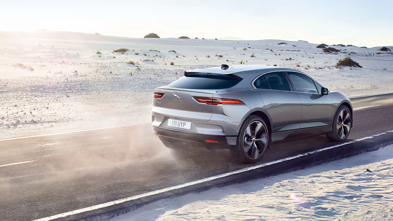 Jaguar I-Pace running on sand road