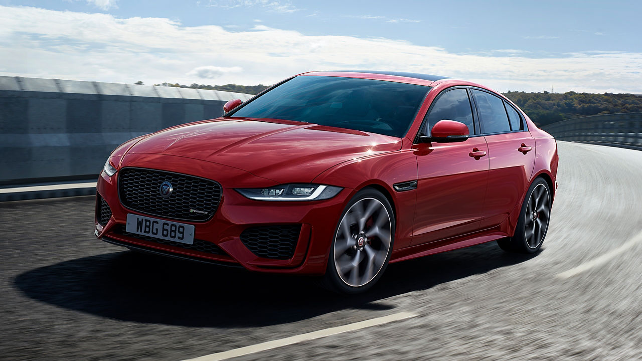 Jaguar XE running on highway bridge