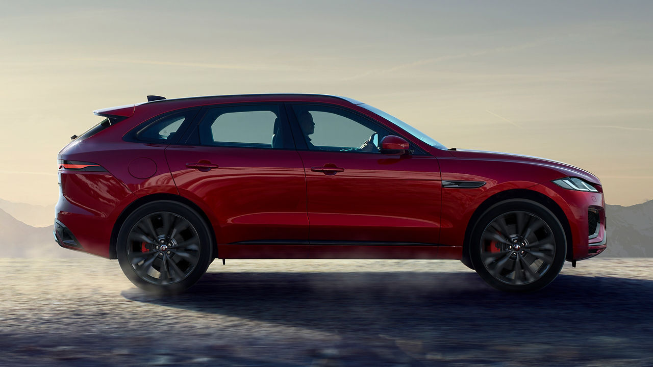 Jaguar F-Pace car moving on road, Side view