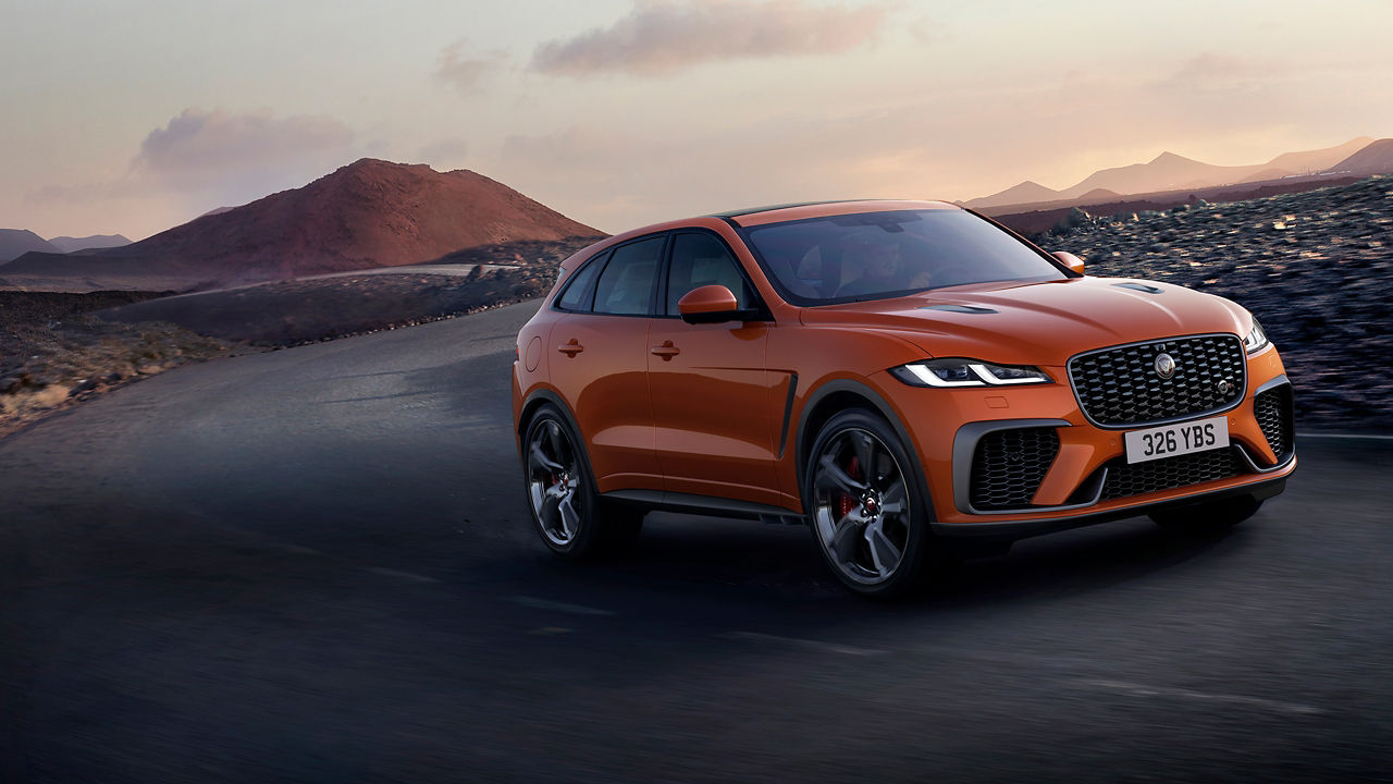 Jaguar car moving on asphalt road