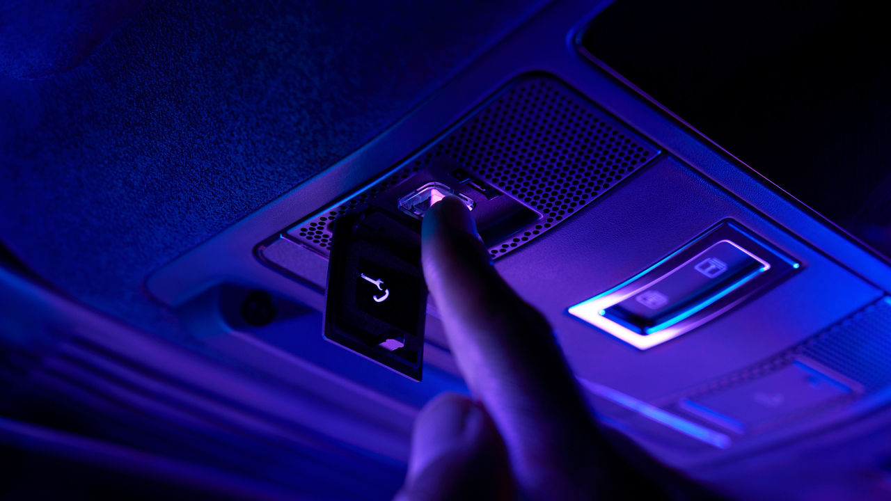 Presses the button of car sunroof
