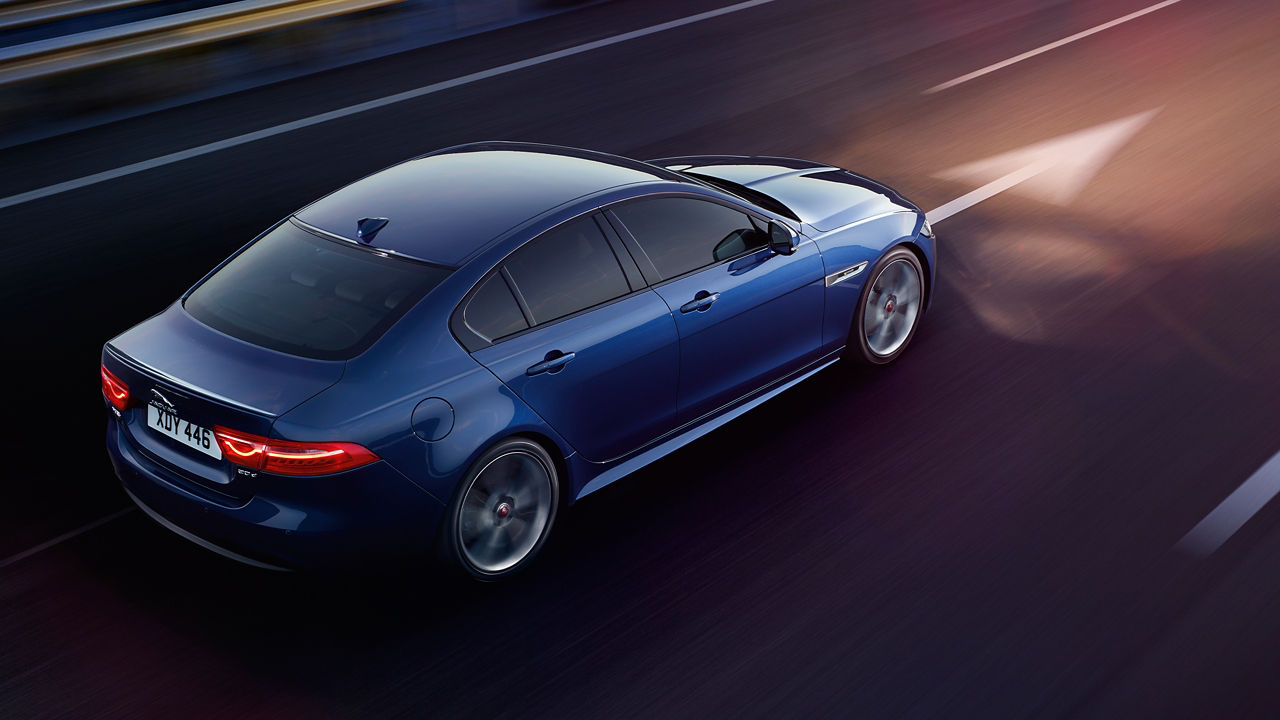 Jaguar XE running on road