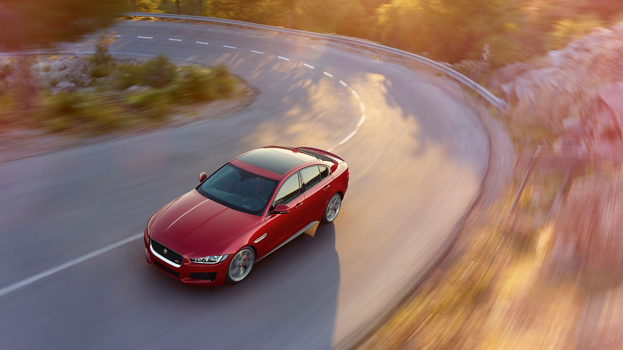 Jaguar XE running on Hilly Road