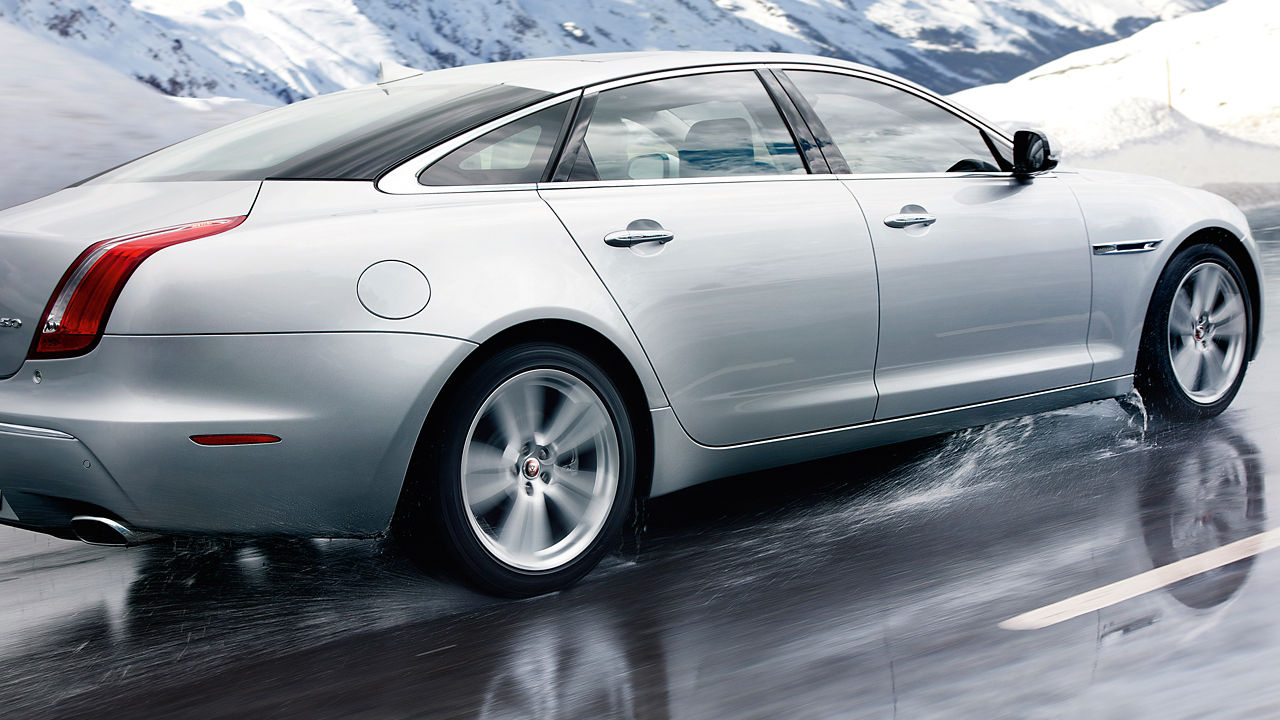 Jaguar XJ Running on Snow Mountain Road