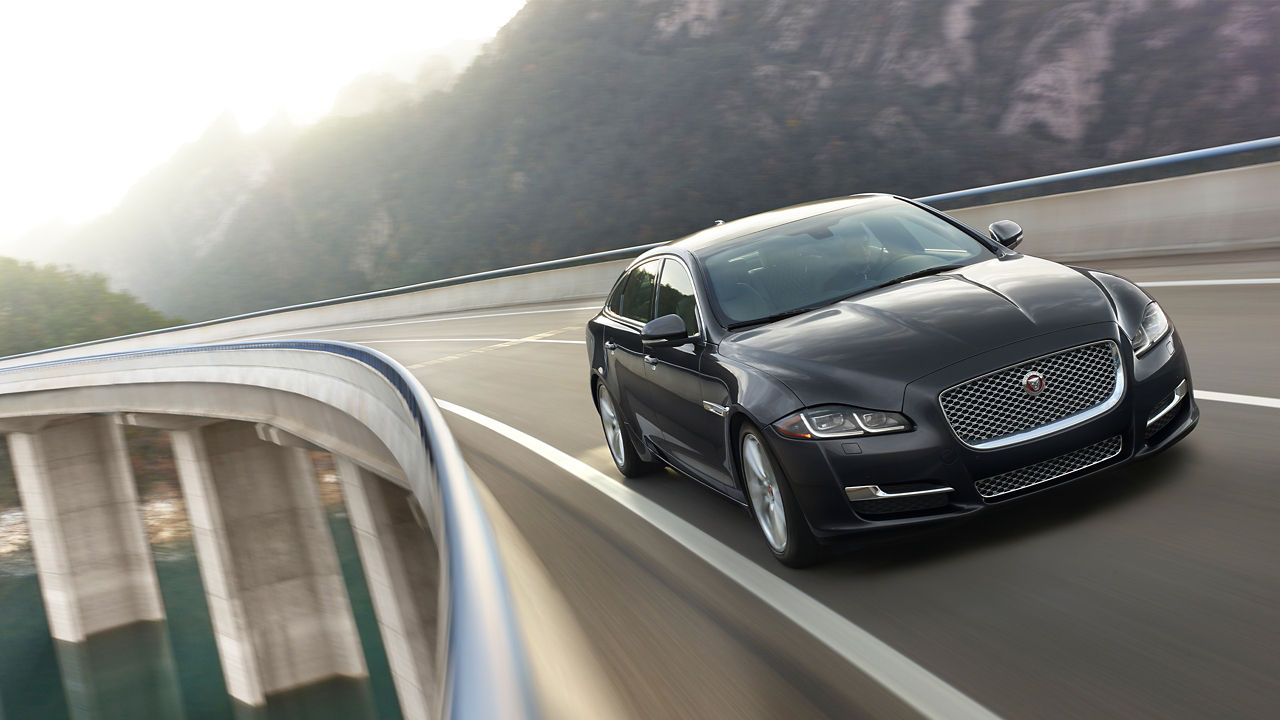 Jaguar XJ running on a Road