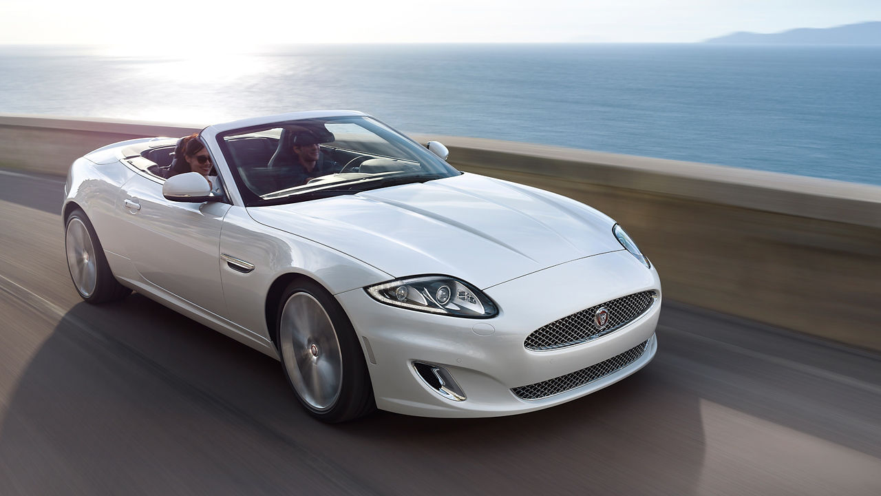 Jaguar XK Moving on Beach Side Road