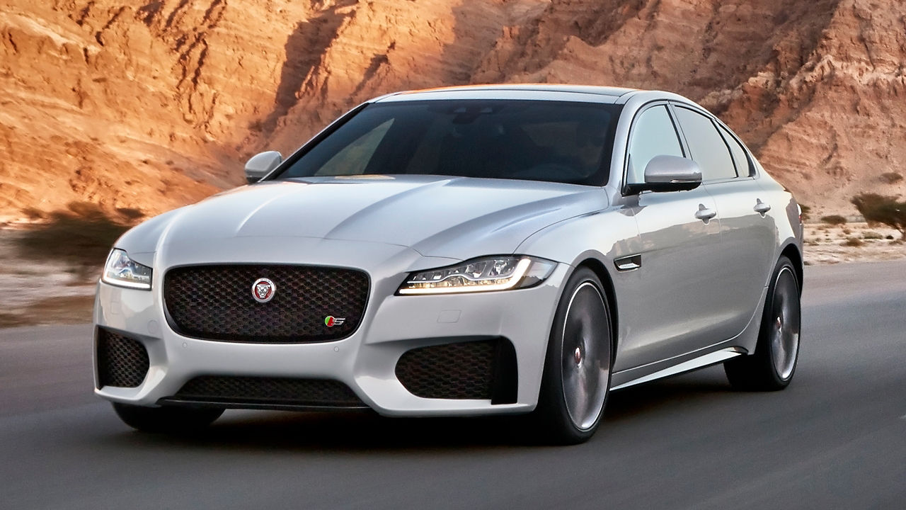 Jaguar XF Moving on Rocky Mountain Road