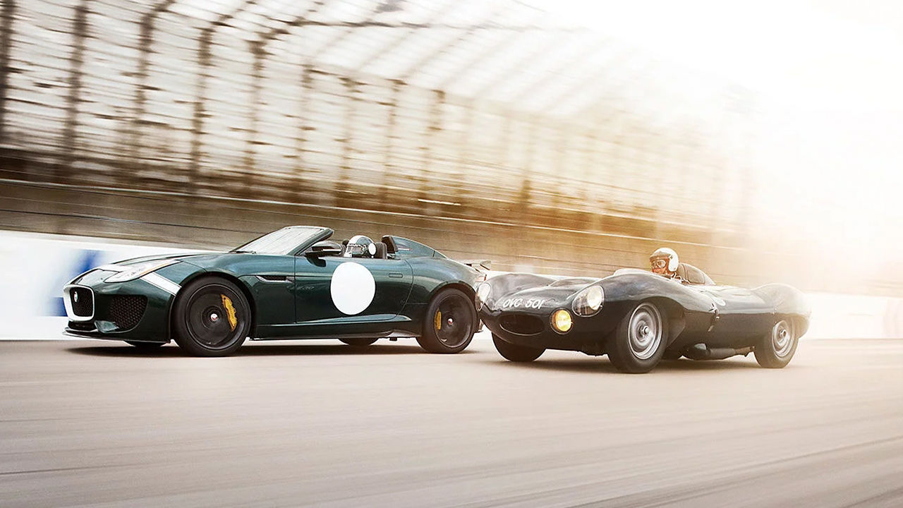 Two Jaguar Classic Running on Sport Track