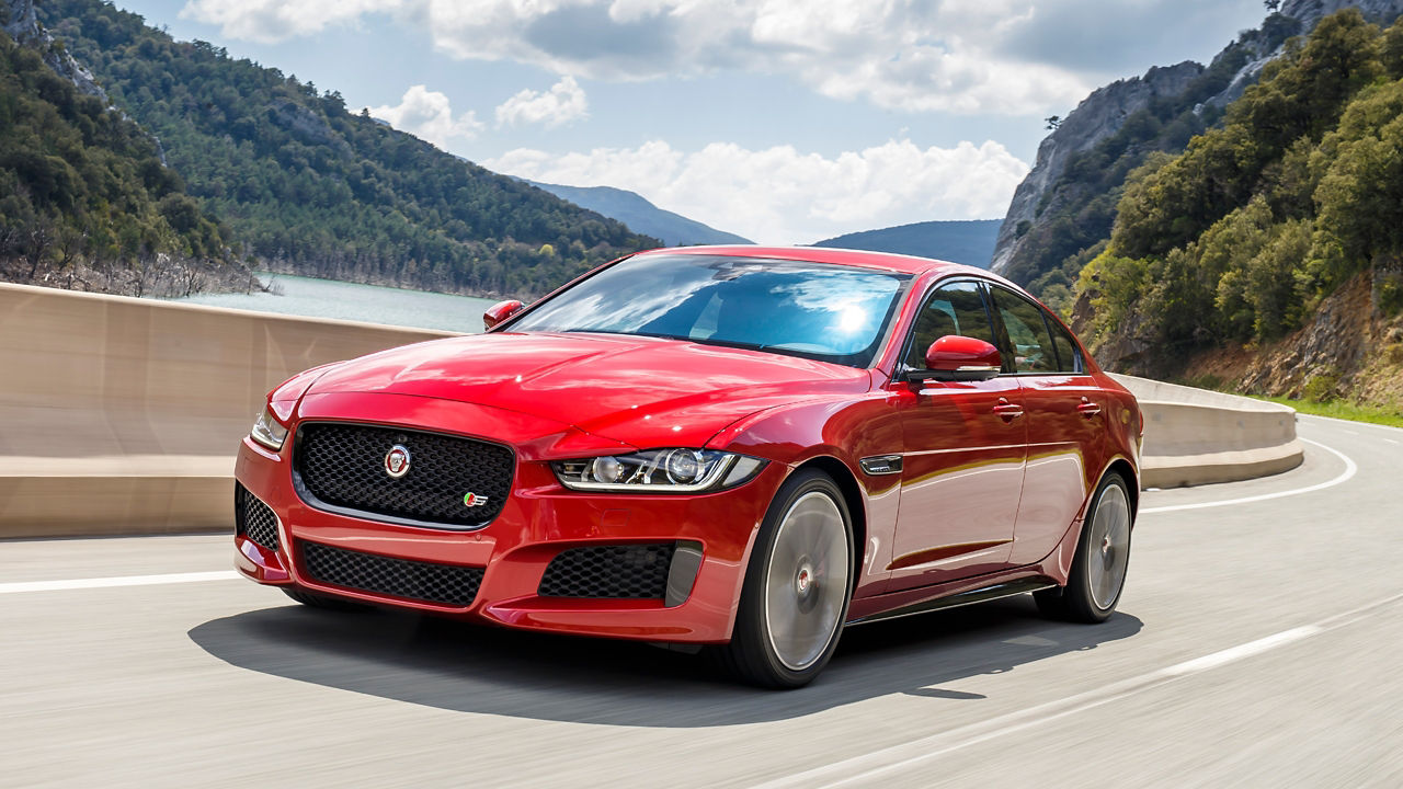 Jaguar XE speeding on the mountain road
