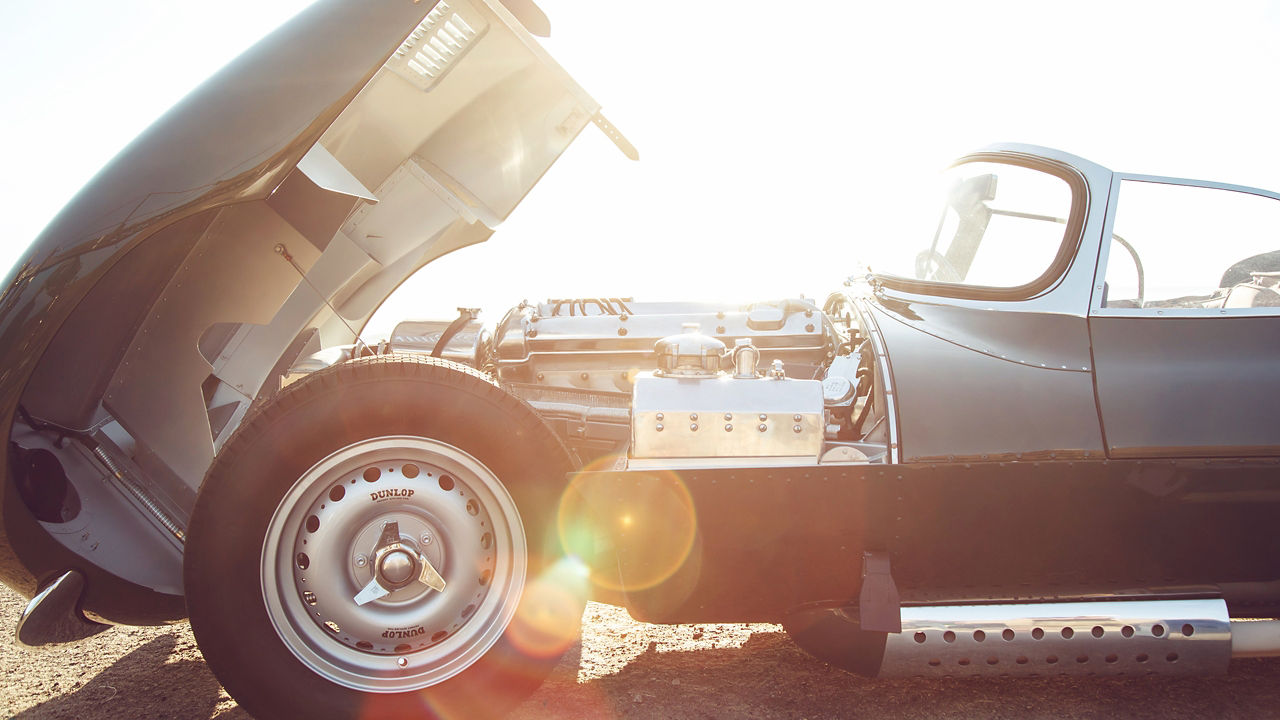 Parked Jaguar XKSS car bonnet door open