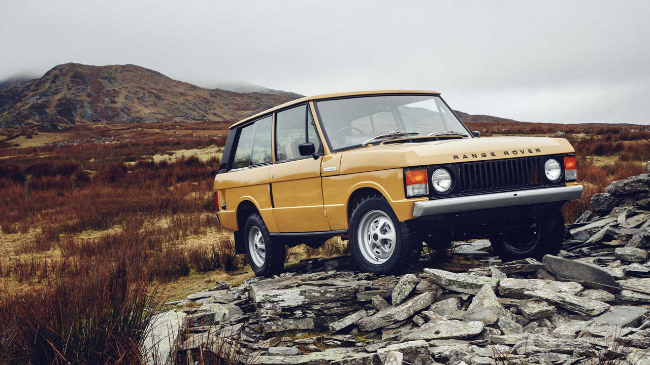 Range Rover classic on a rock