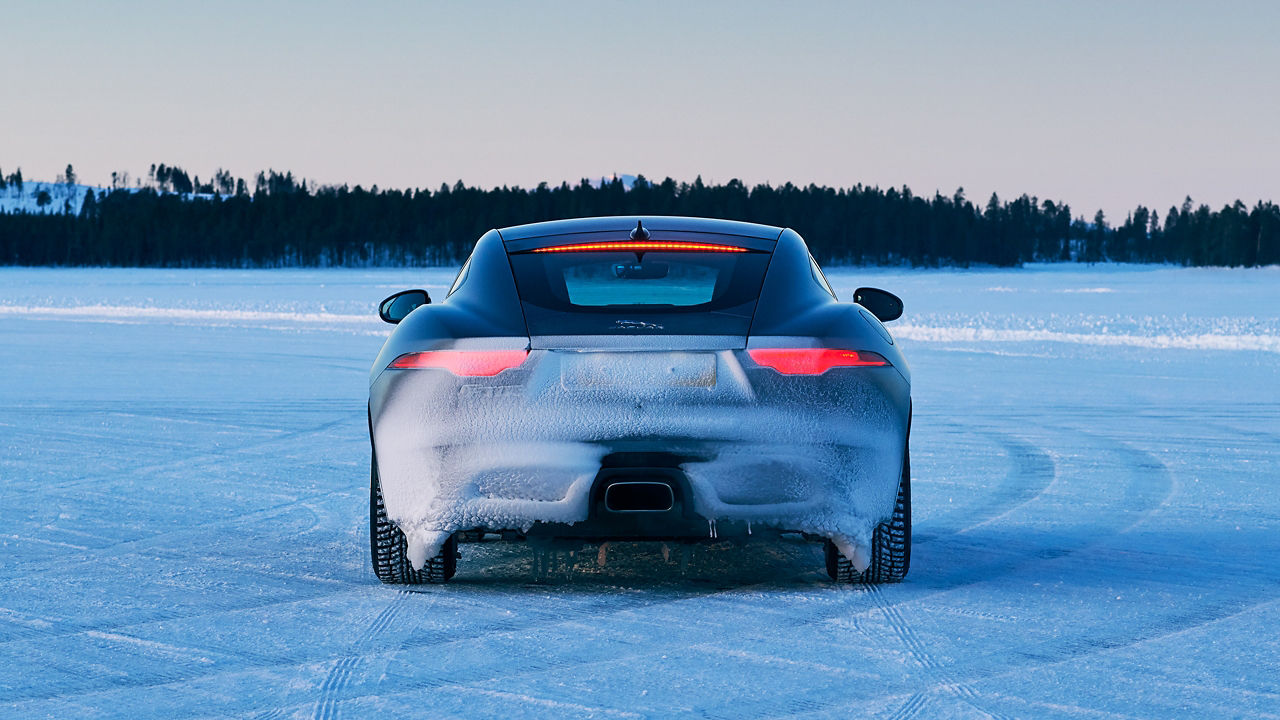 Jaguar F-TYPE running on a snow road